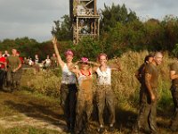 DSC 5373  This was after the slide - a climb up, then down a wooden slide into a pool of mud. Some of us took a header! That's Cathi, Joy (our stud triathlete and former sherriff), and me, I think...
