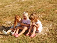DSC 5545  Lindsey, Bridget and Catie relax in the sun while the moms clean up.