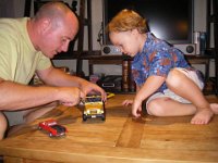 IMGP3036  Playing with a new Jeep Rubicon from Auntie Angel. I REALLY want to get in this Jeep! Sammy and I are talking about getting us one.  A used one. After we trade in the Xterra. First we'd have to send Dave away for a while...not gonna happen ;)