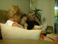 IMGP4853  Reading time with Nana. PopPop is watching baseball.