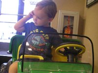 imgp4436  Little guy tractor inside was a big hit. Looks like Sam is calling his buddies, but there's no phone. Just a coincidence.