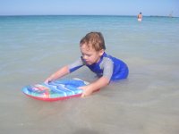 IMGP6975  Testing out a new boogie board just his size! He loives giving tutorials - "this is how you do dis!" or "Can you do dis?"