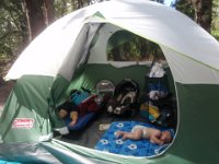 P8220022  Crashed out. Actually, Sam just rested quietly but didn't sleep. It was SO hot in there. Gotta have the rain fly for shade but it's a sauna. Not too many breezes sheltered where we were away from the blowing sand at the beach. I will have to bring Dave's battery powered fan next time...even though I teased him about that piece of gear.