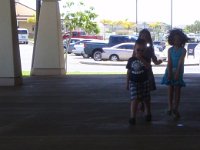 P8170003  Sam is also making friends at church. Here he's playing with two 5 yr old girls - I think it's a game of tag, or freeze.