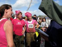IMG 0866  Being interviewed by a reporter. I wish I was quicker on my feet - he was asking why all pink - breast cancer? I was like - um - really just because we needed a color on our heads so we could see each other despite the mud covering our bodies! Cathi and I are wearing our original Swamp Romp bandanas from 2007.