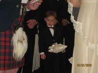 3225 164549900161 578935161 6715447 2243750 n  At the ceremony - Sam was the ringbearer and took his job very seriously. Nice work, little man! He even tried not to step on the rose petals on his way down the aisle.