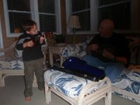 P4150081  Playing the ukulele with Dad! I didn't know Dad had his own, given to him by a friend of his father's who was stationed in HI during WWII.