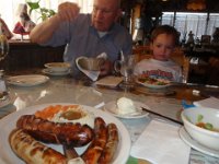 P4180016  Look at these sausages! I am not sure how much Dad got, but not much. The boys ate like you would NOT believe. Sam was stealing from Dad's plate. Ben was long-forking the serving plate. They even ate the German salad and sauerkraut. And of course the apple streudel afterwards.