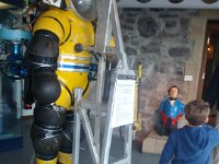 P4260358  We hit the Maritime Museum as well - it's a good museum for kids. Very colorful and I like the circle motif they use throughout. Here is a dive suit that is rated to 1000m. Wow! It's a "Nuit Suit" and uses oil in the joints to allow them to move despite the pressure.