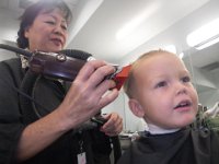 IMGP0977  Ben getting his first haircut! Very excited about the lollipop!