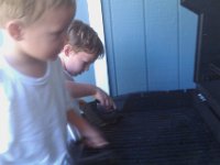 IMAG0511  Cleaning the grill for Daddy is so much fun!