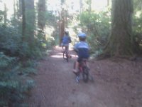 IMAG0844  On a mt bike ride to Battle Pt Park. It's a mile each way through the trees on this awesome trail. I love it! I had to push Ben much of the way due to the hills, so I actually got quite a bit of an unexpected workout!