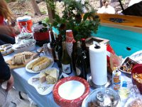 photo 9  The spread! Down at the left is sausage and mustards, Betsey's potato salad (made from Betsey's potatoes grown at Laughing Crow Farm), cioppino from Town and Country and local wines. At the far right is the kiddo snack area...lots of naughtiness down there!
