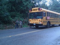 IMAG1311  Sam walking off the school bus with a play date. His first time on a school bus. Of course he's ridden all kinds of other buses.