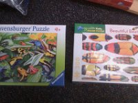 IMAG2011  Sam is really into puzzles - we got the one on the right for him to do after he zipped through a 100 pc puzzle with Nana and PopPop.