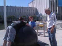 IMAG2035  Now we're at the Pacific Science Center - in the courtyard this 5000 lb granite stone is floating on a thin layer of water - you can spin it around fast!