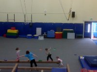 IMAG1855  Doin gbalance beam - he is in the middle of the shot, at the right end of the balance beam.