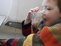 IMGP7887  Ben loves to drink on planes. Which means he also needs to visit the restroom. In a 2 hour flight, he had to go twice. He loves his beverages, though. The second trip was really imperative...just after landing we had to fight our way to the bathroom and back with the aisle filled. urgh! Yes I could limit his beverages, but going to the bathroom gives us all something to do.