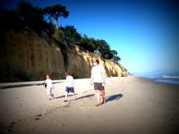 IMGP9319  We were down on a little local beach when the boys decided they wanted to walk up to East Beach from Butterfly Beach - 1.7 mi away and through a narrow area where the tide was lapping up at the rocks. Dave thought it was not such a good idea. I thought it was ok, questionable, though. We didn't want to be "that tourist family" swamped by waves. The boys and I made a run for it - 1/4 mile through the sand outrunning the tide. Most people who live there haven't done this - the hotel staff said they hadn't done it. Doug hadn't. But we made it, thankfully. Here we are on the other side. I texted my brother - he said "And how are you getting back?" We didn't have that figured out yet. But we are good walkers and ended up meeting mom and Richard about halfway back :)