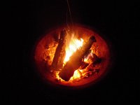 IMGP0060  I found my fire pit had blown out the bottom at the last instant just as I was trying to put a Dutch oven full of chili on it. Excellent timing! I propped the bottom with rocks and hoped for the best. It held.