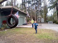 Pic-01172014-001  More fun neighbor boys - this is Stanley throwing - a football through the tire. Dave says this is not the prettiest yard adornment, but I love looking out the window at it. I feel like I am in real BOY country.