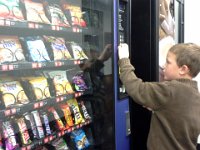 20141017 172622  Carefully selecting what he wants, and watching to see if he has enough money. This guy knows his coins and counting money well before the school standards as a result ;)