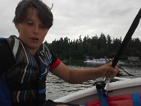 20160702 191241  My first time in a sailboat - with Hap at the helm He's a good sailor, but the glint in his eye tells me I might be in for a ride!